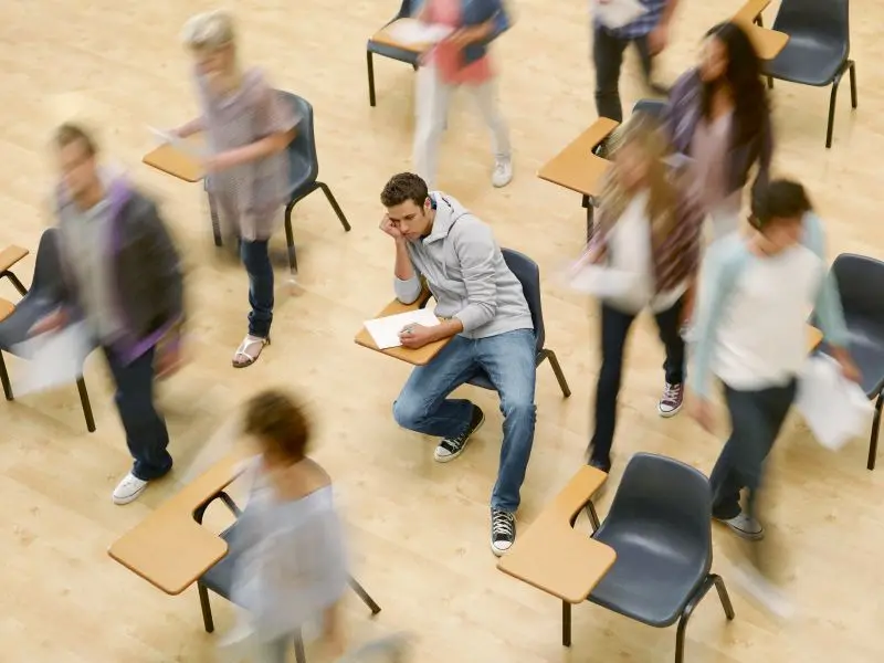 A group of people standing around each other.